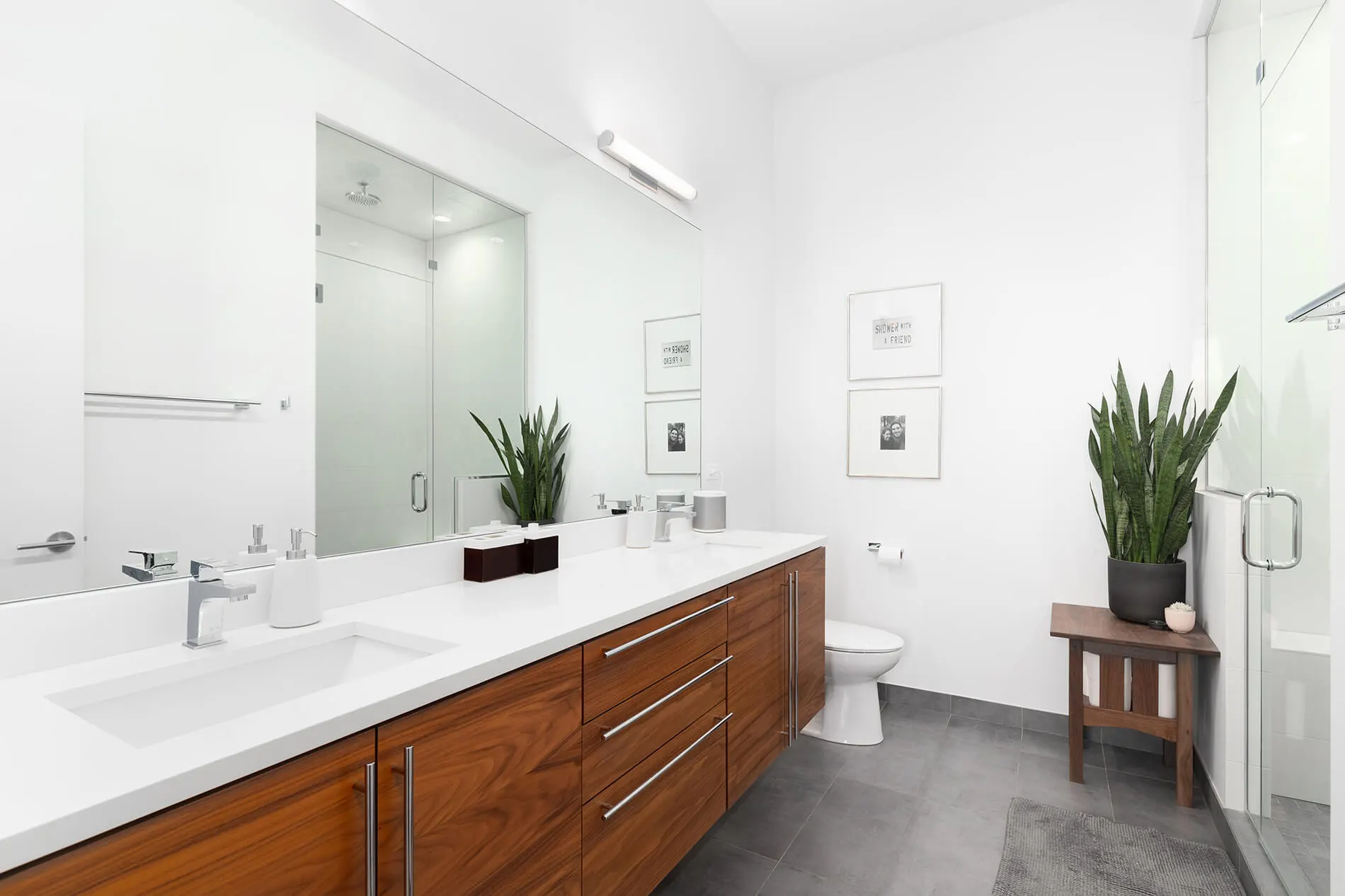 Renovated bathroom in Ballarat with timber floating vanity and walk-in glass shower