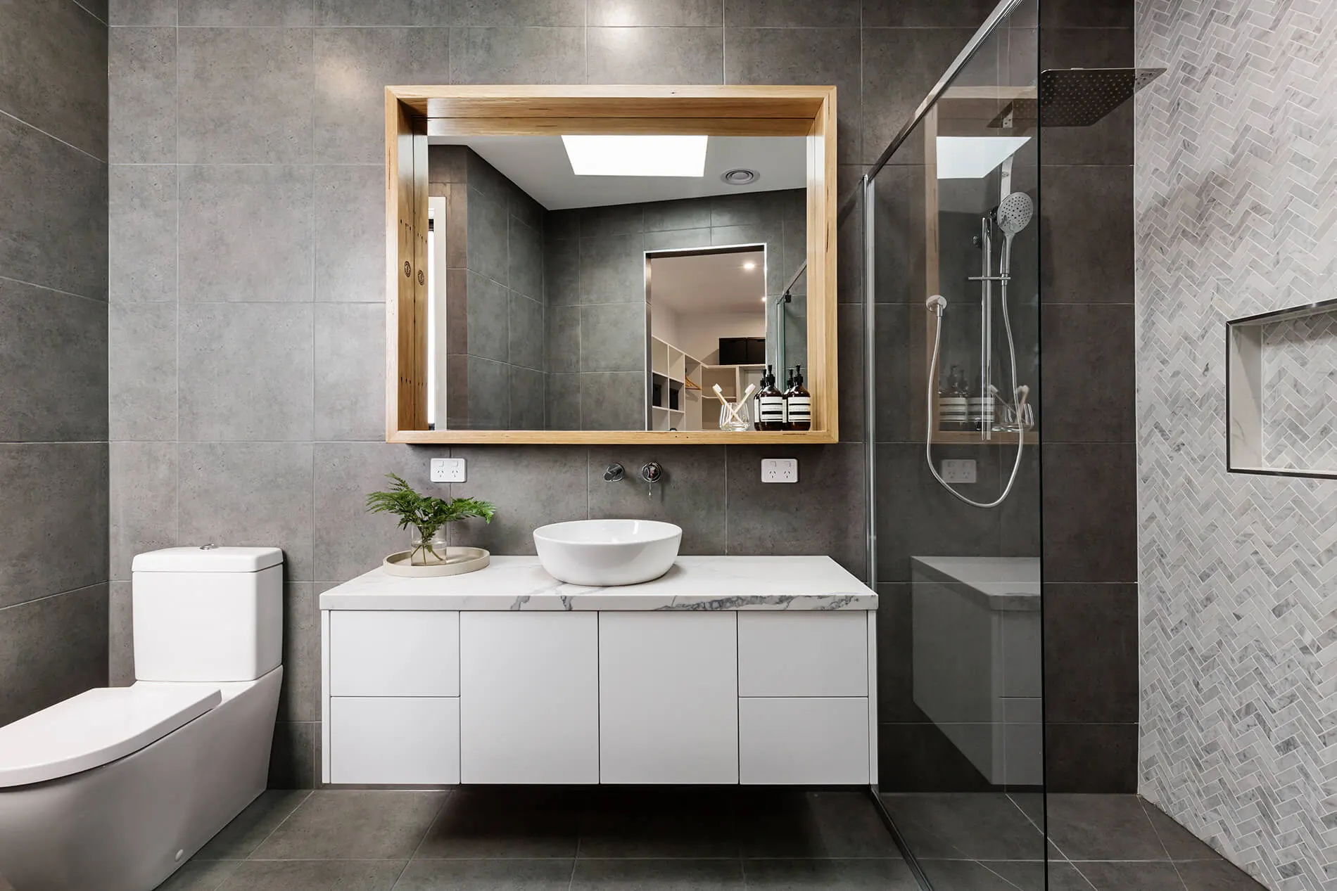 Vessel basin and timber-framed mirror beside a glass-walled shower in a Ballarat bathroom renovation