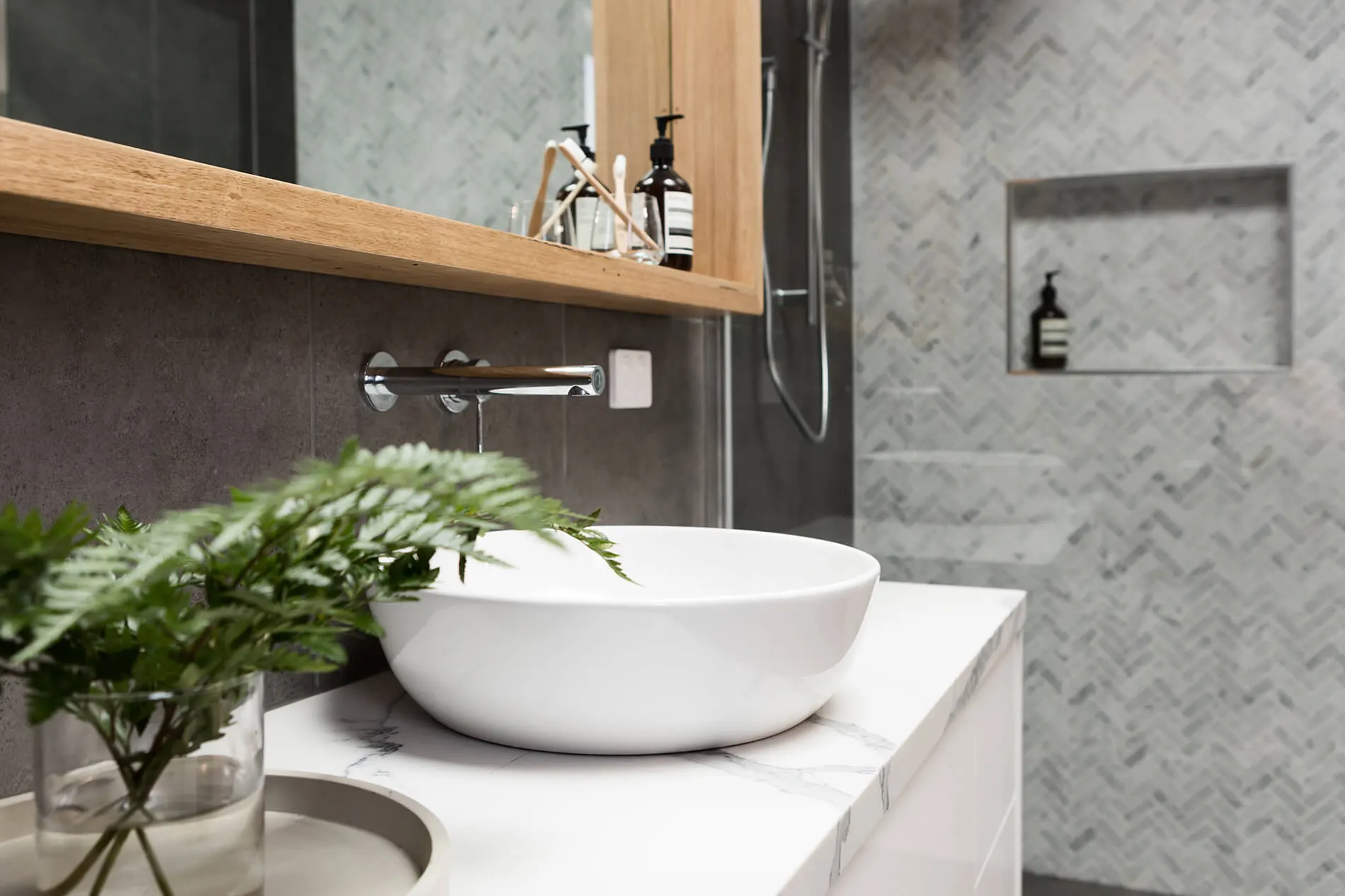 Black freestanding bath in a dark-toned main bathroom renovation in Ballarat
