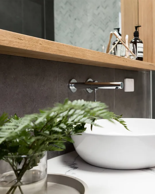 Wall-mounted chrome tap and vessel basin in a renovated Ballarat bathroom